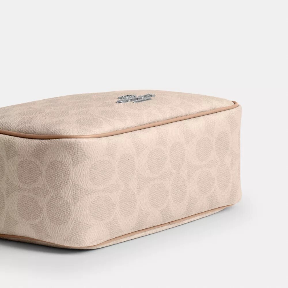 Bolso mini Carey de bandolera en Signature Canvas