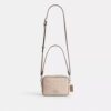Bolso mini Carey de bandolera en Signature Canvas