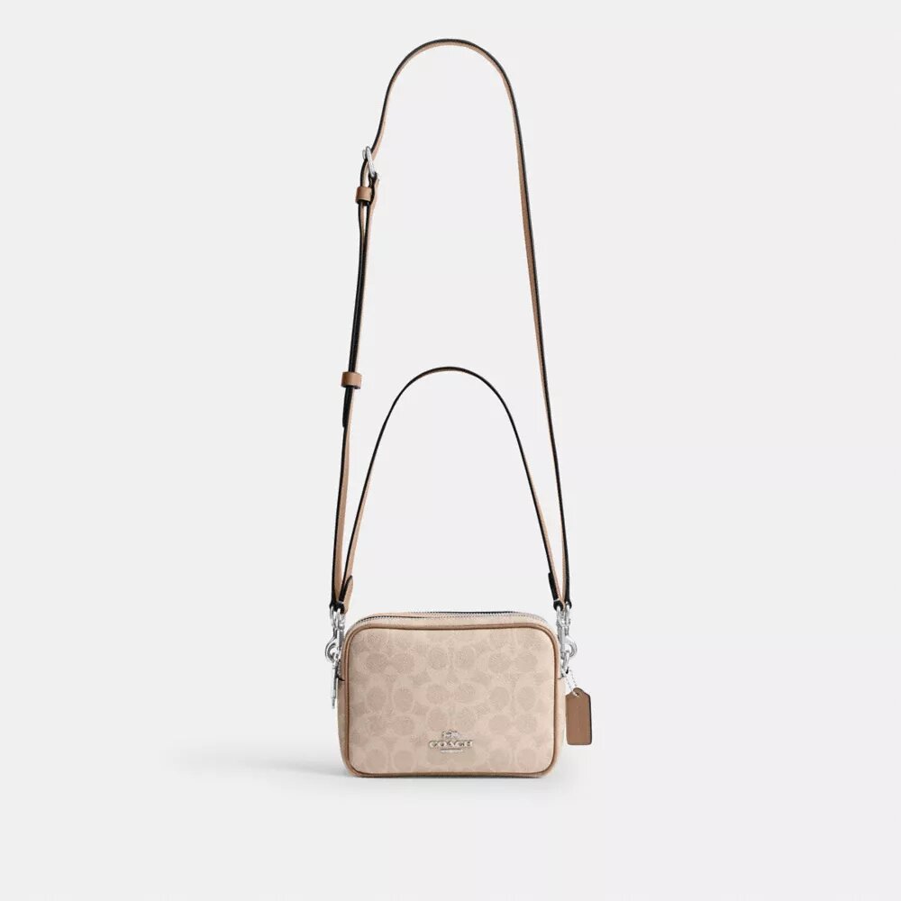 Bolso mini Carey de bandolera en Signature Canvas