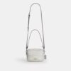 Bolso mini Carey de bandolera en Signature Canvas