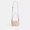 Bolso mini Carey de bandolera en Signature Canvas