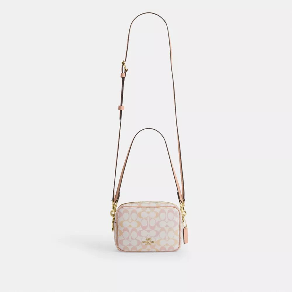 Bolso mini Carey de bandolera en Signature Canvas