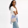Bolso mini Carey de bandolera en Signature Canvas
