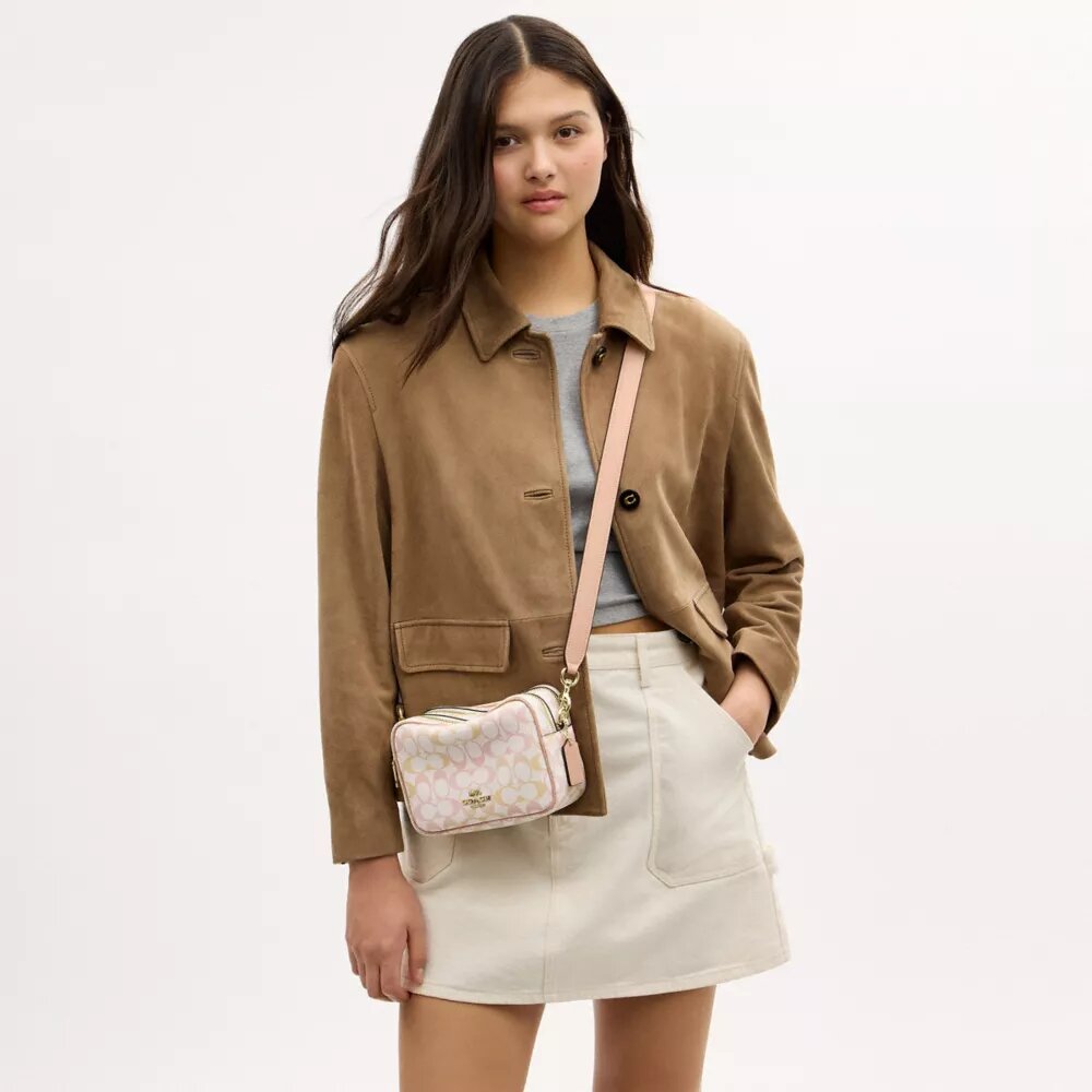 Bolso mini Carey de bandolera en Signature Canvas