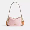 Bolso mini Carey de bandolera en Signature Canvas con Charms