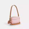 Bolso mini Carey de bandolera en Signature Canvas con Charms