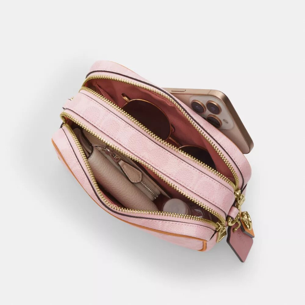 Bolso mini Carey de bandolera en Signature Canvas con Charms
