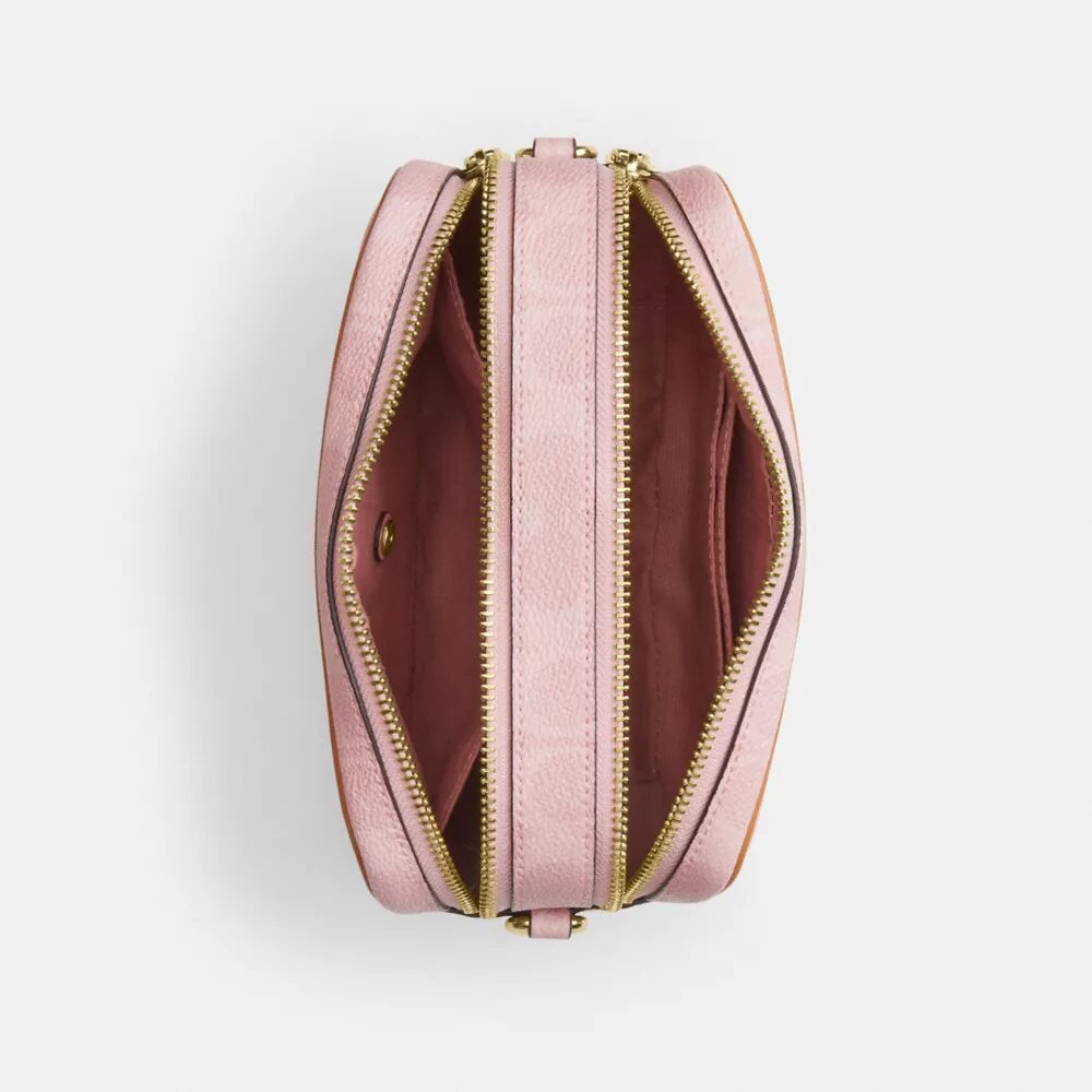 Bolso mini Carey de bandolera en Signature Canvas con Charms