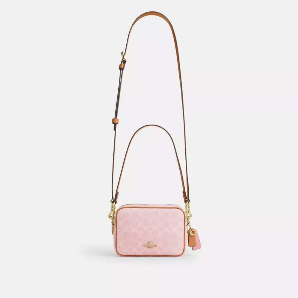 Bolso mini Carey de bandolera en Signature Canvas con Charms