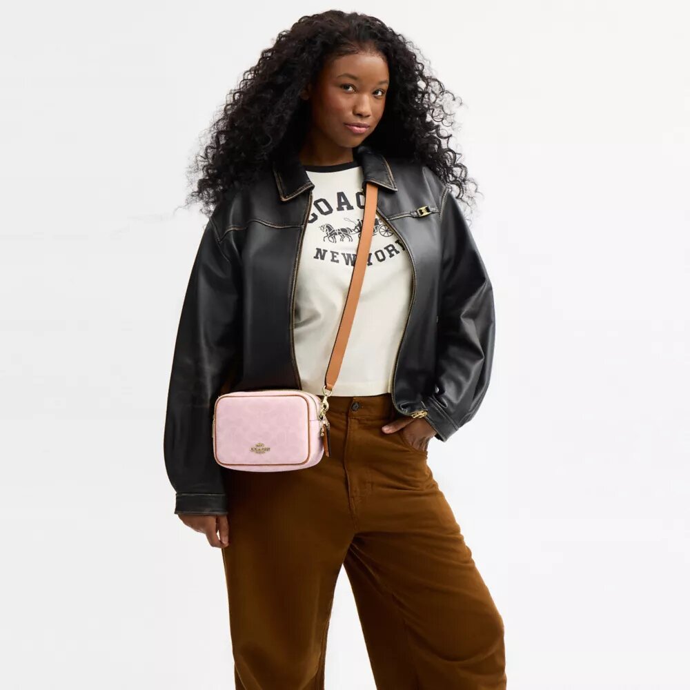 Bolso mini Carey de bandolera en Signature Canvas con Charms