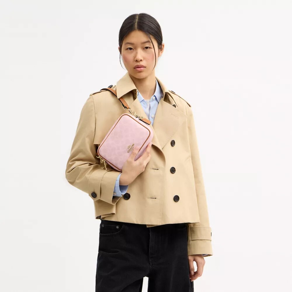 Bolso mini Carey de bandolera en Signature Canvas con Charms