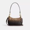 Bolso mini cruzado Teri en lona Signature Canvas