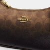 Bolso mini cruzado Teri en lona Signature Canvas