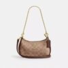 Bolso mini cruzado Teri en Signature Canvas