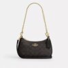 Bolso mini cruzado Teri en Signature Canvas