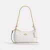 Bolso mini cruzado Teri en Signature Canvas