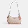Bolso mini cruzado Teri en Signature Canvas