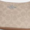 Bolso mini cruzado Teri en Signature Canvas