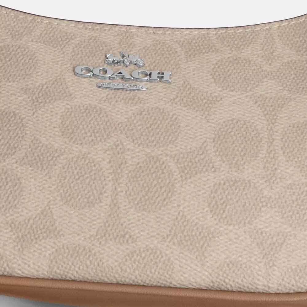 Bolso mini cruzado Teri en Signature Canvas