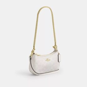 Bolso mini cruzado Teri en Signature Canvas