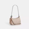 Bolso mini cruzado Teri en Signature Canvas