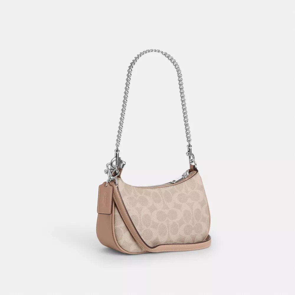 Bolso mini cruzado Teri en Signature Canvas