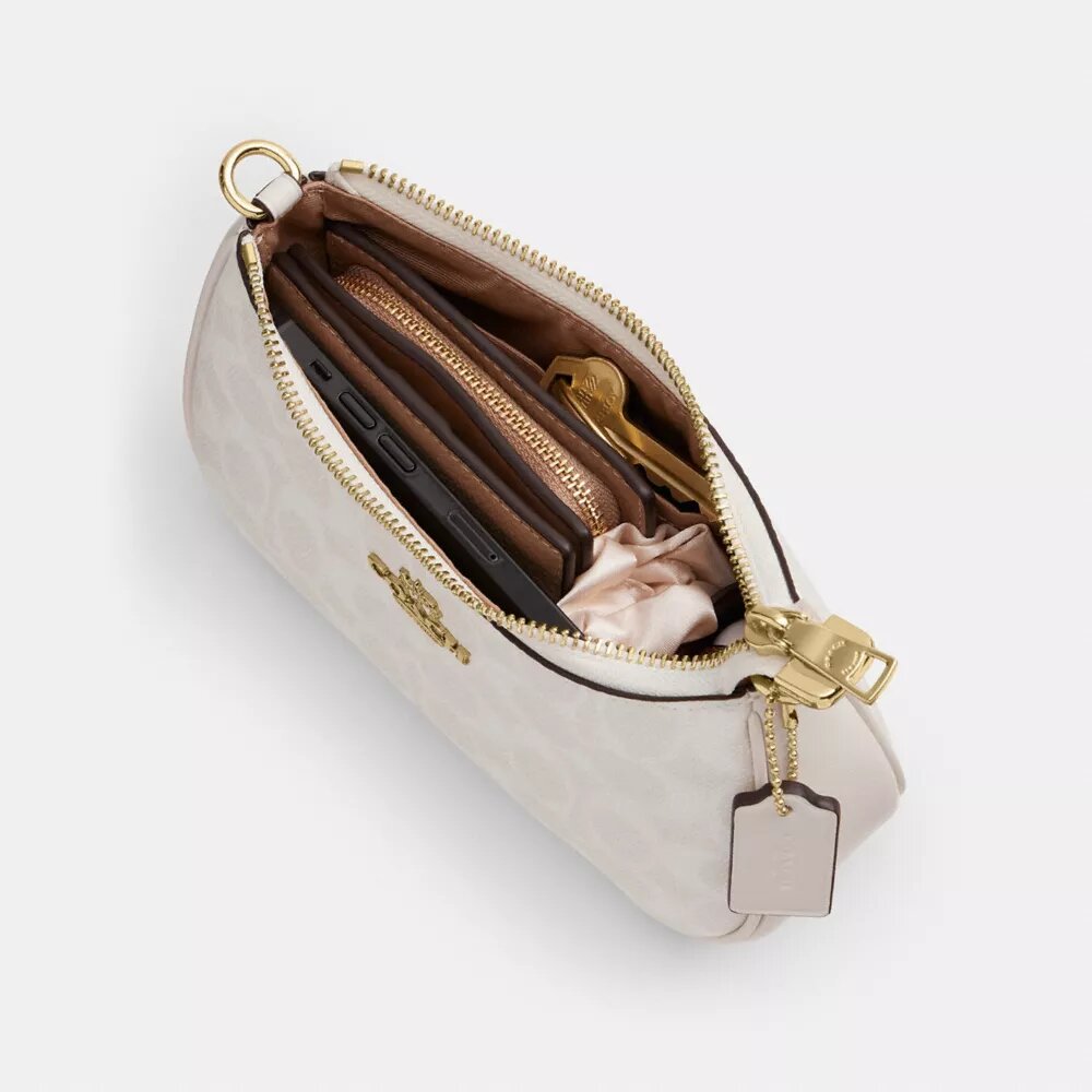 Bolso mini cruzado Teri en Signature Canvas