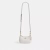 Bolso mini cruzado Teri en Signature Canvas