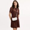 Bolso mini cruzado Teri en Signature Canvas