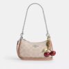 Bolso mini cruzado Teri en Signature Canvas