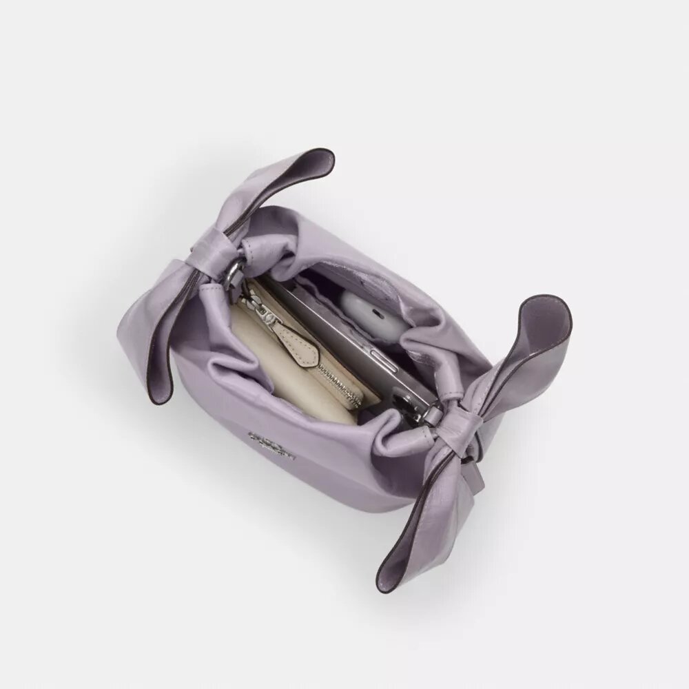 Bolso mini Faye con cordón y moños
