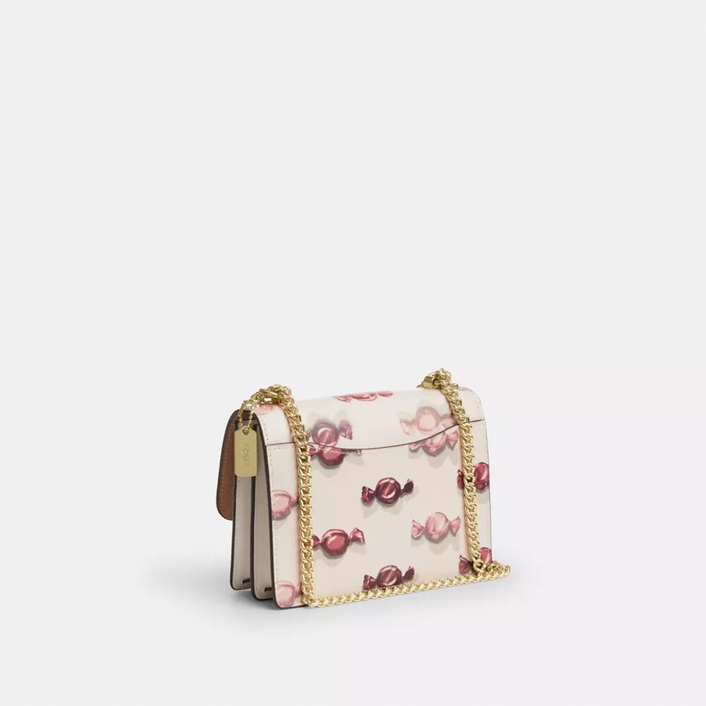 Bolso mini Klare de bandolera con estampado de dulces