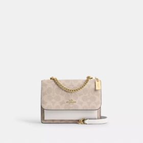 Bolso mini Klare de bandolera en Signature Canvas