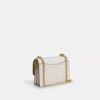 Bolso mini Klare de bandolera en Signature Canvas