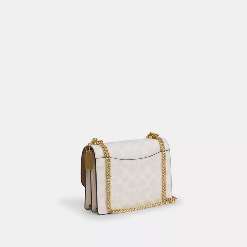 Bolso mini Klare de bandolera en Signature Canvas