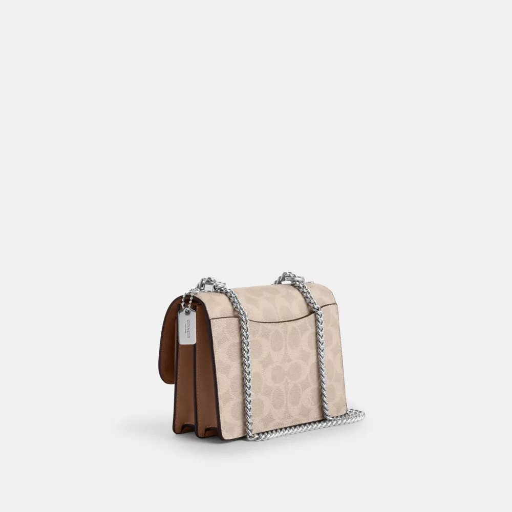 Bolso mini Klare de bandolera en Signature Canvas