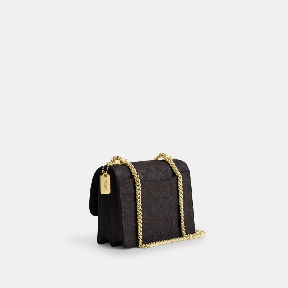 Bolso mini Klare de bandolera en Signature Canvas