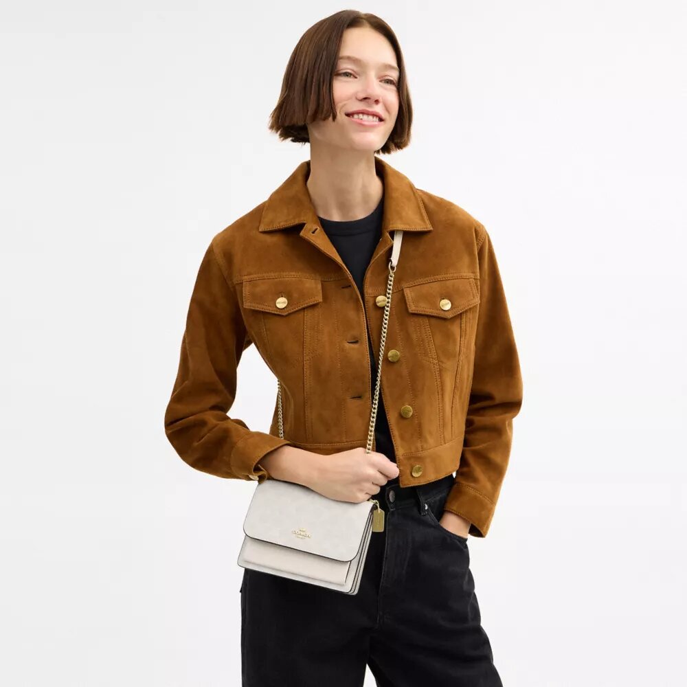 Bolso mini Klare de bandolera en Signature Canvas