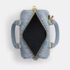 Bolso mini Rowan de bandolera en denim desgastado con Charms
