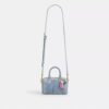 Bolso mini Rowan de bandolera en denim desgastado con Charms
