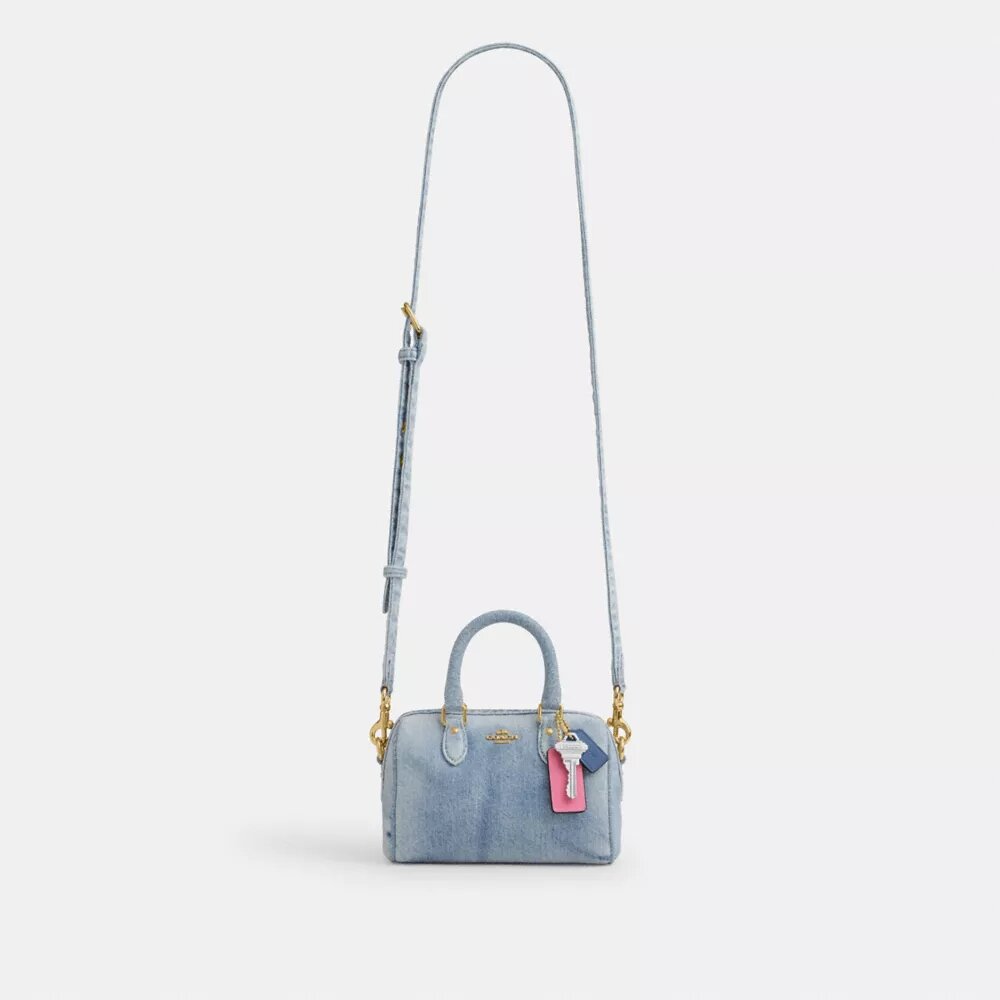 Bolso mini Rowan de bandolera en denim desgastado con Charms