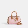 Bolso mini Rowan de bandolera en Signature Canvas con Charms