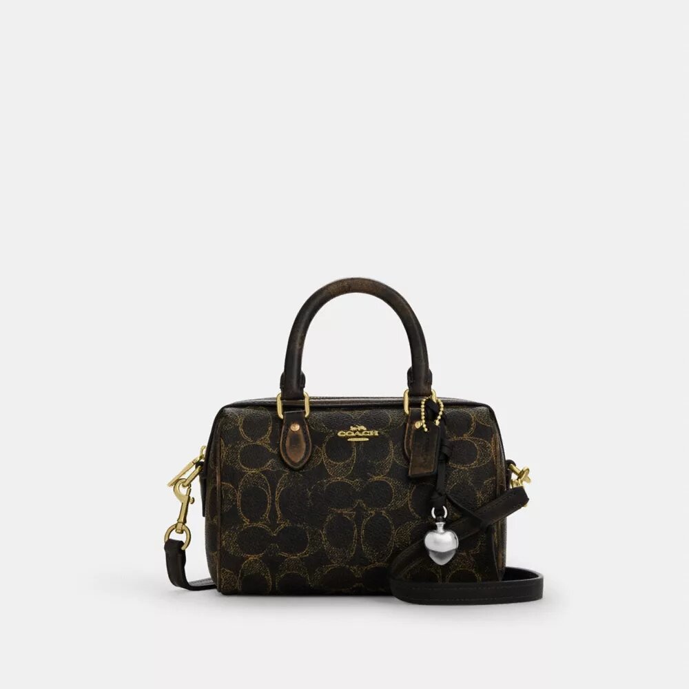 Bolso mini Rowan de bandolera en Signature Canvas con Charms