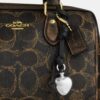 Bolso mini Rowan de bandolera en Signature Canvas con Charms