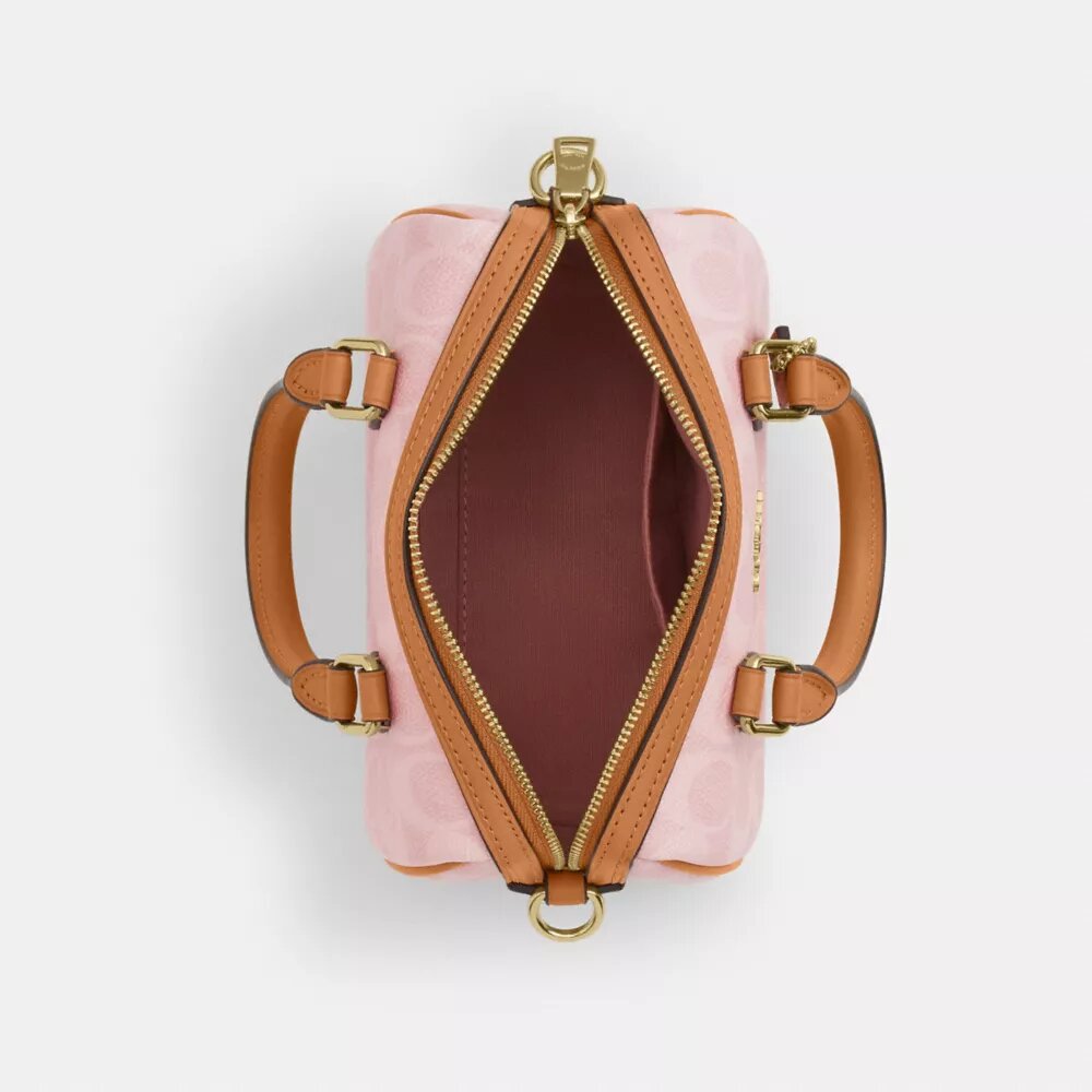 Bolso mini Rowan de bandolera en Signature Canvas con Charms
