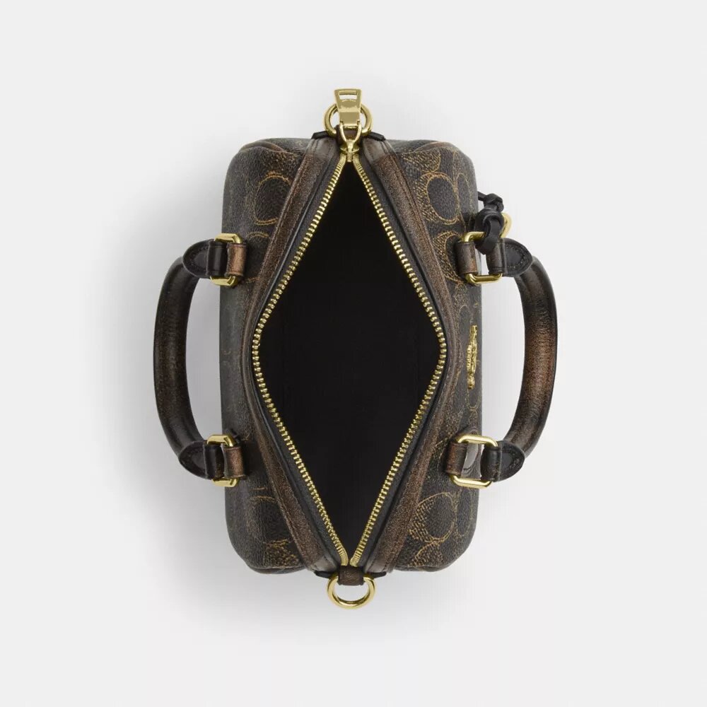 Bolso mini Rowan de bandolera en Signature Canvas con Charms