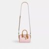 Bolso mini Rowan de bandolera en Signature Canvas con Charms