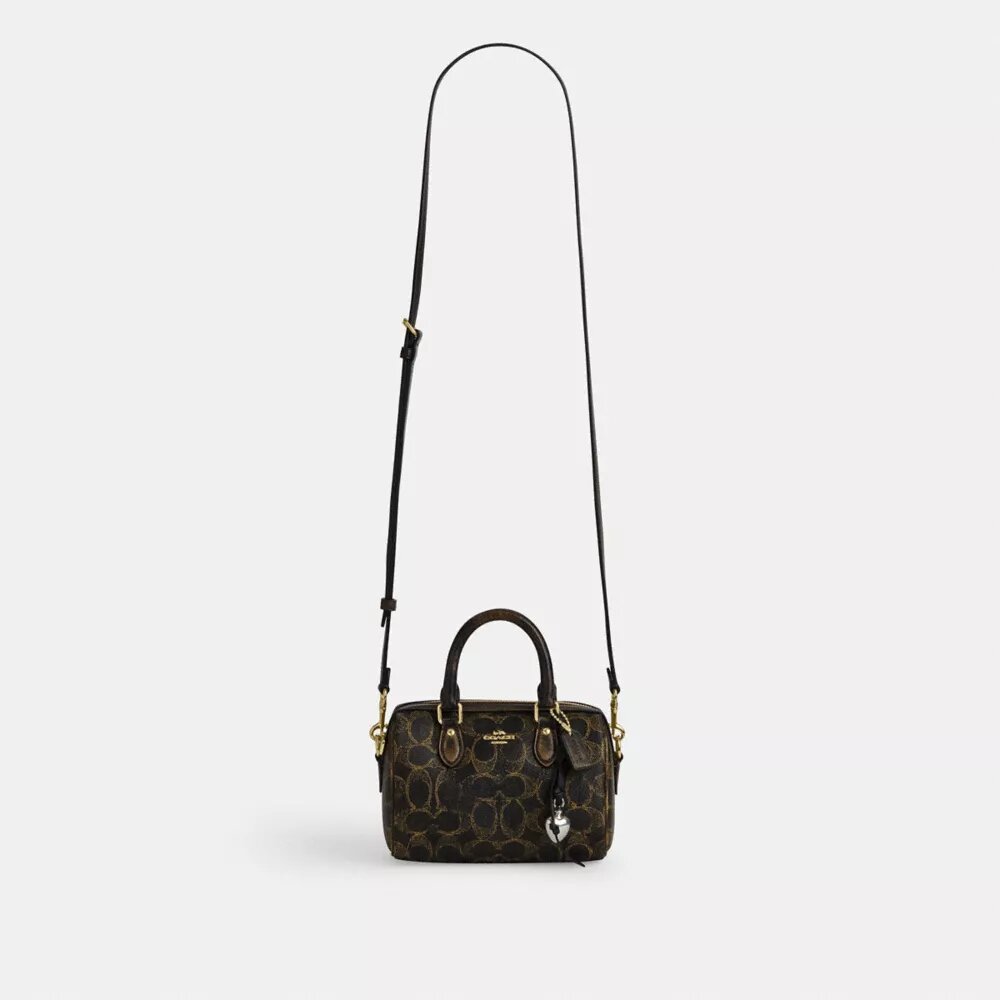 Bolso mini Rowan de bandolera en Signature Canvas con Charms
