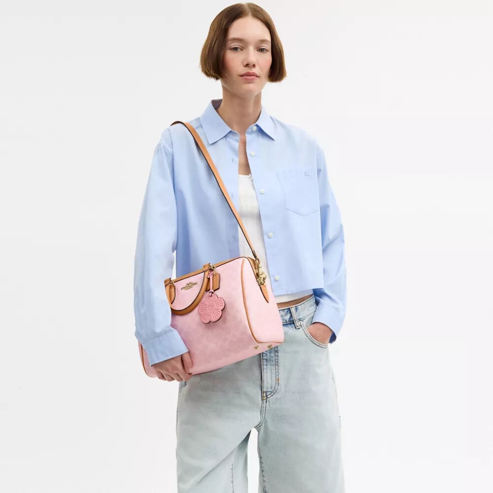 Bolso tipo cartera grande Rowan en Signature Canvas con Charms