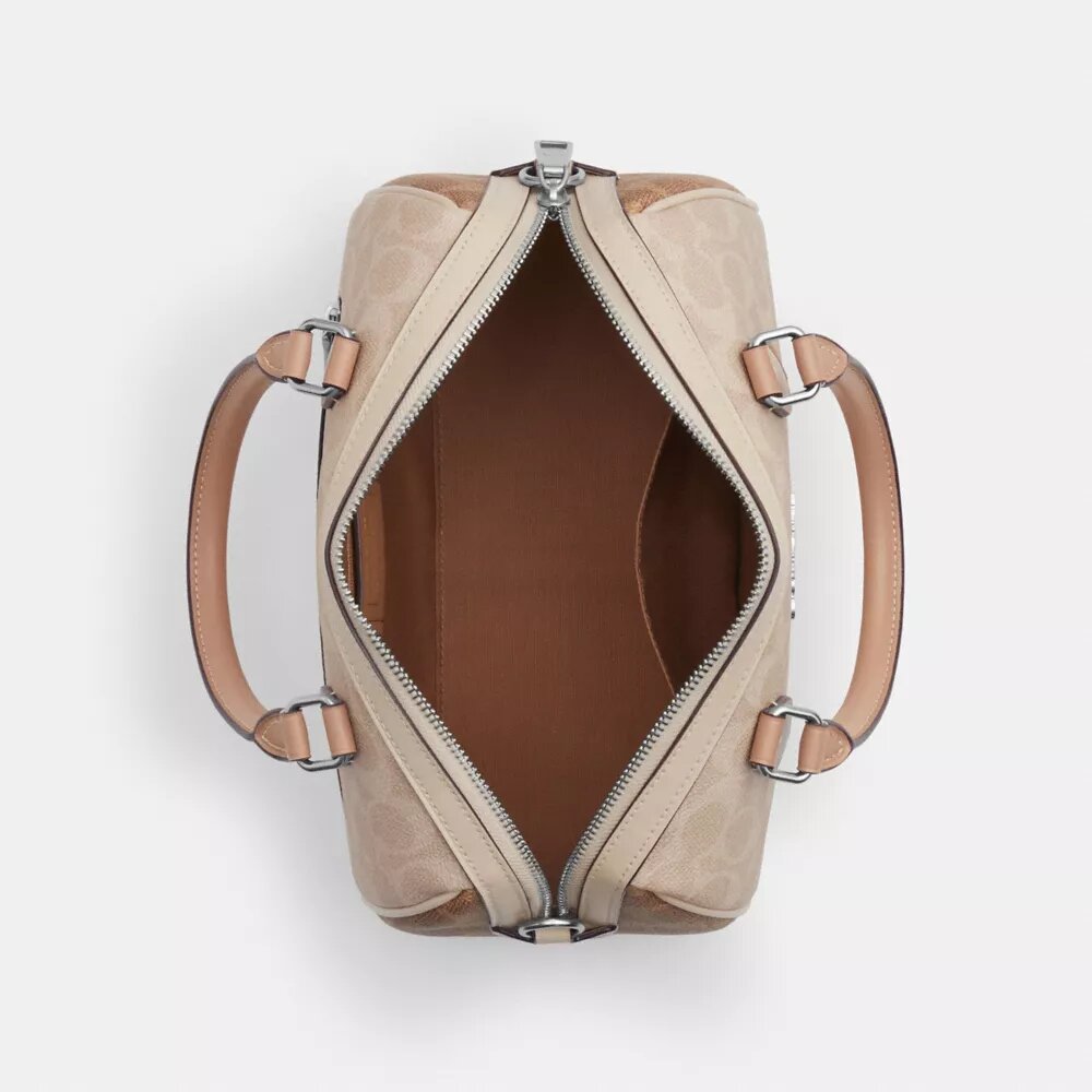 Bolso tipo cartera Rowan en Signature Canvas con diseño en bloques característico